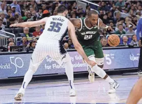  ?? ASSOCIATED PRESS ?? Khris Middleton tied season highs by playing 31 minutes and scoring 24 points, and he set a season high with 11 assists.