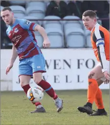  ??  ?? Lee Duffy sends the ball into the box.