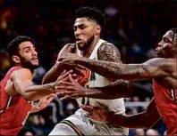  ?? Hans Pennink / Special to the Times Union ?? Siena guard Anthony Gaines, center, scored a team-high 15 points against Marist on Friday. The Saints face a tough battle against Saint Peter’s, which leads the MAAC in several defensive and rebounding categories.