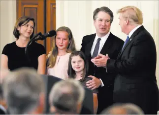  ?? Evan Vucci ?? The Associated Press President Donald Trump greets Judge Brett Kavanaugh, his Supreme Court nominee, in the East Room of the White House on Monday.
