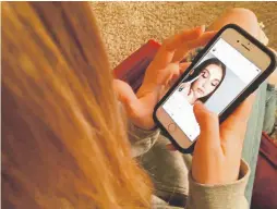  ?? Photos by Haven Daley, Associated Press file ?? Laurel Foster looks at Instagram in San Francisco in November. Developers say as teens scroll through some apps, they leave digital footprints that may offer clues about their psyches.