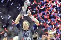  ?? AP PHOTO ?? New England Patriots’ Tom Brady raises the Vince Lombardi Trophy after defeating the Atlanta Falcons in overtime at the NFL Super Bowl 51 football game Sunday, Feb. 5, 2017, in Houston. Brady, the seven-time Super Bowl winner with New England and Tampa Bay, announced his retirement from the NFL on Wednesday, Feb. 1, 2023 exactly one year after first saying his playing days were over. He leaves the NFL with more wins, yards passing and touchdowns than any other quarterbac­k.