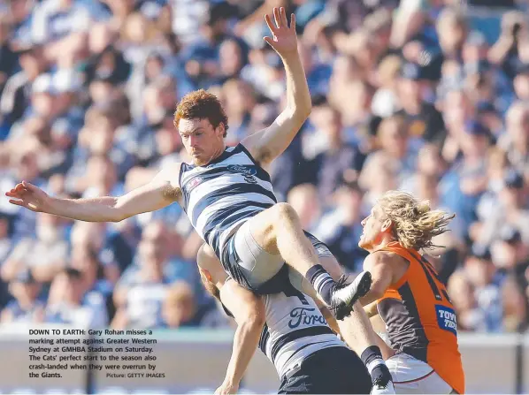  ?? Picture: GETTY IMAGES ?? DOWN TO EARTH: Gary Rohan misses a marking attempt against Greater Western Sydney at GMHBA Stadium on Saturday. The Cats’ perfect start to the season also crash-landed when they were overrun by the Giants.