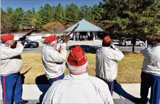  ?? PHOTOS BY HYOSUB SHIN / HYOSUB.SHIN@AJC.COM ?? John Newport (foreground) leads a salute during a funeral at Georgia National Cemetery in Canton on Nov. 1. The ceremony Tuesday will honor seven WWII veterans.