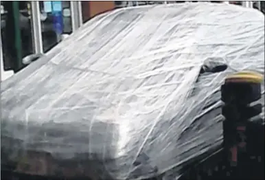  ??  ?? A car was wrapped in cling film outside Mothercare in Wincheap