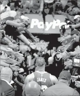  ?? Christian Petersen Getty Images ?? LeBRON JAMES walks off after scoring 19 points with 11 assists and seven rebounds, and hitting the go-ahead three-pointer in the final minutes.