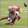  ?? AP photo ?? George Kittle of the 49ers is hit by the Cardinals’ Budda Baker during the first half Sunday.