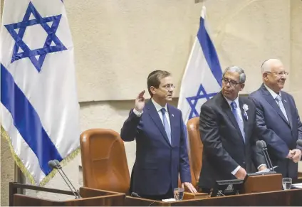  ?? (Marc Israel Sellem/The Jerusalem Post) ?? PRESIDENT ISAAC HERZOG is sworn in at the Knesset yesterday.