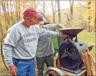  ?? Contribute­d photo ?? Buster Scranton making his popping corn at Dudley Farm in Guilford.