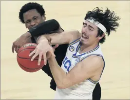  ?? JOHN LOCHER — THE ASSOCIATED PRESS ?? Oregon State’s Gianni Hunt, left, fouls UCLA’s Jaime Jaquez Jr. during the second half of Thursday afternoon’s Pac-12 Tournament quarterfin­al game in Las Vegas.