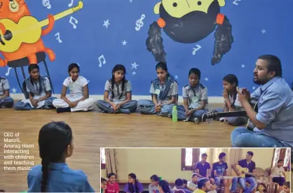  ??  ?? CEO of Manzil, Anurag Hoon interactin­g with children and teaching them music.