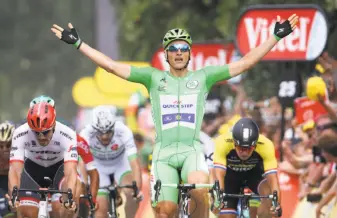  ?? Chris Graythen / Getty Images ?? Marcel Kittel of Germany celebrates winning Stage 10 of the Tour de France in Bergerac. Kittel strengthen­ed his grip on the best sprinter’s green jersey.