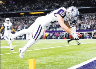 ?? Tom Fox ?? The Associated Press Cowboys wide receiver Ryan Switzer dives into the end zone for a touchdown on a punt return during the first half against the Redskins on Thursday in Arlington, Texas.