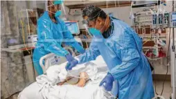  ?? Gabrielle Lurie / The Chronicle 2020 ?? Nurses attend to a COVID-19 patient in the intensive care unit at Regional Medical Center of San Jose in December 2020. A Stanford study may explain why obese people are at higher risk for severe COVID.