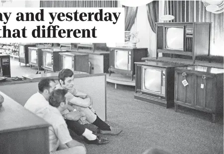  ?? FILE PHOTO BY RON FREHM/AP ?? People watch the Apollo 11 Saturn V rocket launch at a Sears in White Plains, N.Y., on July 16, 1969.