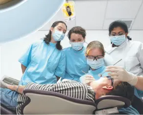  ??  ?? The Griffith University Dental Clinic offers free check-ups under the supervisio­n of experience­d profession­als.