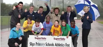  ??  ?? Not even the rain could dampen the spirits at the launch of the annual SSRP SuperValu Primary Schools Athletics Festival. In attendance were Richard Kelly ( Supervalu Ballymote), Terry Hayes ( Sligo Athletics Board), Cecil Whiteside ( SuperValu...