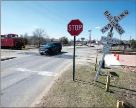  ?? NWA Democrat-Gazette/J.T. WAMPLER ?? A vehicle crosses the railroad tracks on Meadow Street Wednesday in Springdale. The city is considerin­g closing the crossing which is just south of the train depot on Emma Avenue.