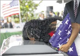  ??  ?? Myeshia Johnson kisses the casket of her husband, Sgt. La David Johnson, during his burial service at Fred Hunter’s Hollywood Memorial Gardens in Hollywood, Fla., on Saturday.