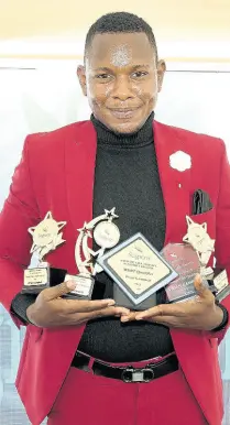  ?? ?? A 2021 Million Dollar Round Table and Century Club qualifier, Vivian Campbell, shows of his trophy haul.