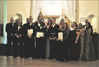  ?? MARCIE LANDEROS PHOTO ?? Members of the Imperial Valley Regional Chamber of Commerce and the Naval Air Facility El Centro pose for a picture during the Imperial Valley Regional Chamber of Commerce 16th Annual Air Show Gala on Friday, February 24, in El Centro.