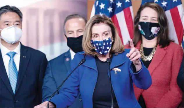  ?? Agence France-presse ?? ↑
US Speaker of the House Nancy Pelosi speaks to the press after the Senate voted to acquit Donald Trump in the US Capitol, Washington DC, on Saturday.