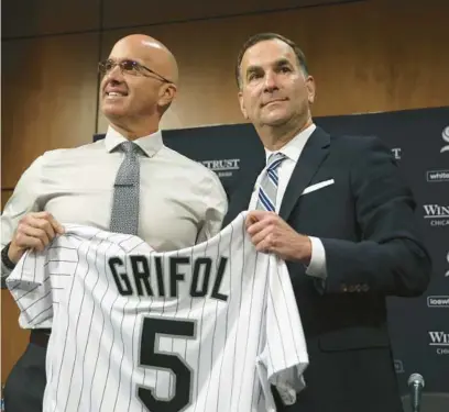  ?? BRIAN CASSELLA/CHICAGO TRIBUNE ?? New White Sox manager Pedro Grifol, left, stands with general manager Rick Hahn as he is introduced at a news conference Thursday at Guaranteed Rate Field.