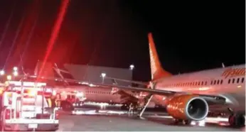  ?? CTV/TWITTER ?? Emergency crews respond after an empty Sunwing aircraft clipped the wing of a WestJet aircraft on the tarmac.