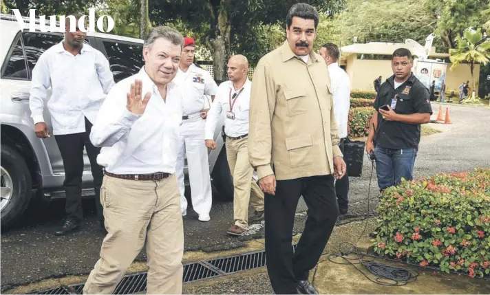  ?? FOTO: AFP ?? ►► El Presidente colombiano, Juan Manuel Santos, y el mandatario venezolano, Nicolás Maduro, en agosto de 2016, en Caracas.