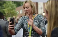  ?? SAIT SERKAN GURBUZ/THE ASSOCIATED PRESS ?? Olympic swimmer Katie Ledecky uses Snapchat at the Team USA Awards.