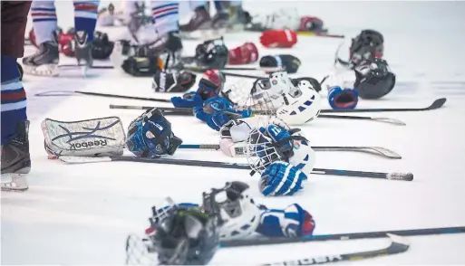  ?? CHRIS SO TORONTO STAR FILE PHOTO ?? It will be a while before minor hockey players can grab their helmets and sticks, but the GTHL hopes to have on-ice action, either training or games, this season.