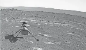  ?? NASA/JPL-CALTECH ?? NASA’s Ingenuity helicopter, as viewed by the Perseveran­ce rover’s camera, sits on the Mars surface April 4.