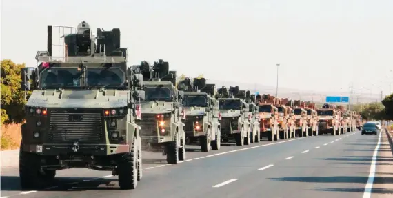  ?? Reuters ?? A Turkish military convoy is pictured in Kilis near the Turkish-Syrian border, as Ankara launches Operation Peace Spring in northern Syria on Wednesday afternoon.