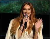  ?? BRYAN BEDDER – GETTY IMAGES ?? Lindsay Lohan speaks during the “Irish Wish” New York premiere at Paris Theater on Tuesday in New York City.