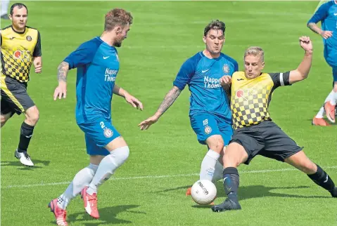  ??  ?? Action from Brownlands Park where Lochee United (blue) lost 3-2 to hosts Luncarty.