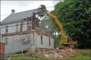  ??  ?? Crews from Geppert Brothers demolish the Keenan home in Perkase Sept. 4.