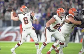  ?? NICK WASS/AP ?? Browns quarterbac­k Baker Mayfield looks to pass as center JC Tretter (64) and guard Joel Bitonio block against the Ravens on Nov. 28.