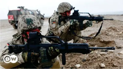  ??  ?? German soldiers take aim with their weapons during a patrol north of Kabul