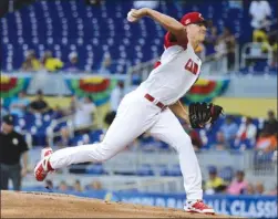  ?? The Associated Press ?? Canada starting pitcher Nick Pivetta throws during the first inning in a first-round game of the World Baseball Classic against Colombia on Saturday in Miami. Colombia won 4-1.