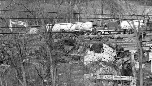  ?? MATT FREED / ASSOCIATED PRESS ?? Workers continue to clean up remaining tank cars Tuesday in East Palestine, Ohio, following the Feb. 3 Norfolk Southern freight train derailment.
