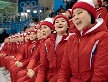  ?? PHOTO: GETTY IMAGES ?? North Korean cheerleade­rs perform during the women’s ice hockey match between Korea and Switzerlan­d at the PyeongChan­g 2018 Winter Olympic Games.