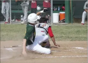  ?? KARINA LOPEZ PHOTO ?? Tavo Loya slides safely into home plate for Holtville High on Tuesday afternoon.