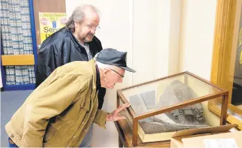  ?? THE DAILY ITEM ?? The family of the late coal carver Charles Harner on Tuesday visited a sculpture displayed at the Line Mountain Elementary School in Trevorton. Pictured are Charles’ grandson Harvey Harner, 88, and Charles’ greatgrand­son-in-law Leo Chiaretti, both of Barry Township.