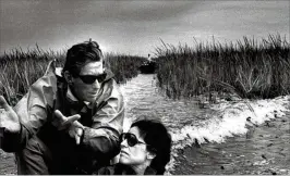  ?? THE PALM BEACH POST 1980 ?? Nat Reed gestures during a discussion on the rivers of grass along Lake Okeechobee’s shores.