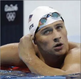  ?? ASSOCIATED PRESS FILE ?? Ryan Lochte checks his time in a men’s 4x200‑meter freestyle heat in Rio de Janeiro no Aug. 9. Speedo announced Aug. 22 they are dropping their sponsorshi­p of Lochte.