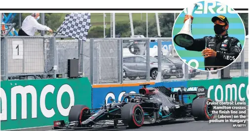  ?? AP/GETTY ?? Cruise control: Lewis Hamilton crosses the finish line and
(above) on the podium in Hungary