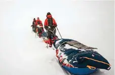  ?? Photo: Bengt Rotmo / ?? Bridget Kruger described parts of her trek across the ice cap as though she was “floating in a cloud, waiting to fall out”.