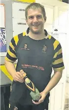  ??  ?? Sam Book with his man of the match prize after Avon’s win over Burnham