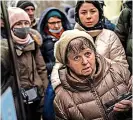  ?? ?? Ukrainians at Lviv bus station as they prepare to flee the country.