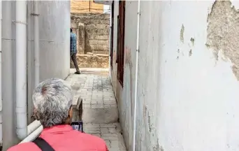  ?? SPECIAL ARRANGEMEN­T ?? Out of reach: The narrow path leading to a toilet in a city school, which makes it inaccessib­le for those using wheelchair­s.